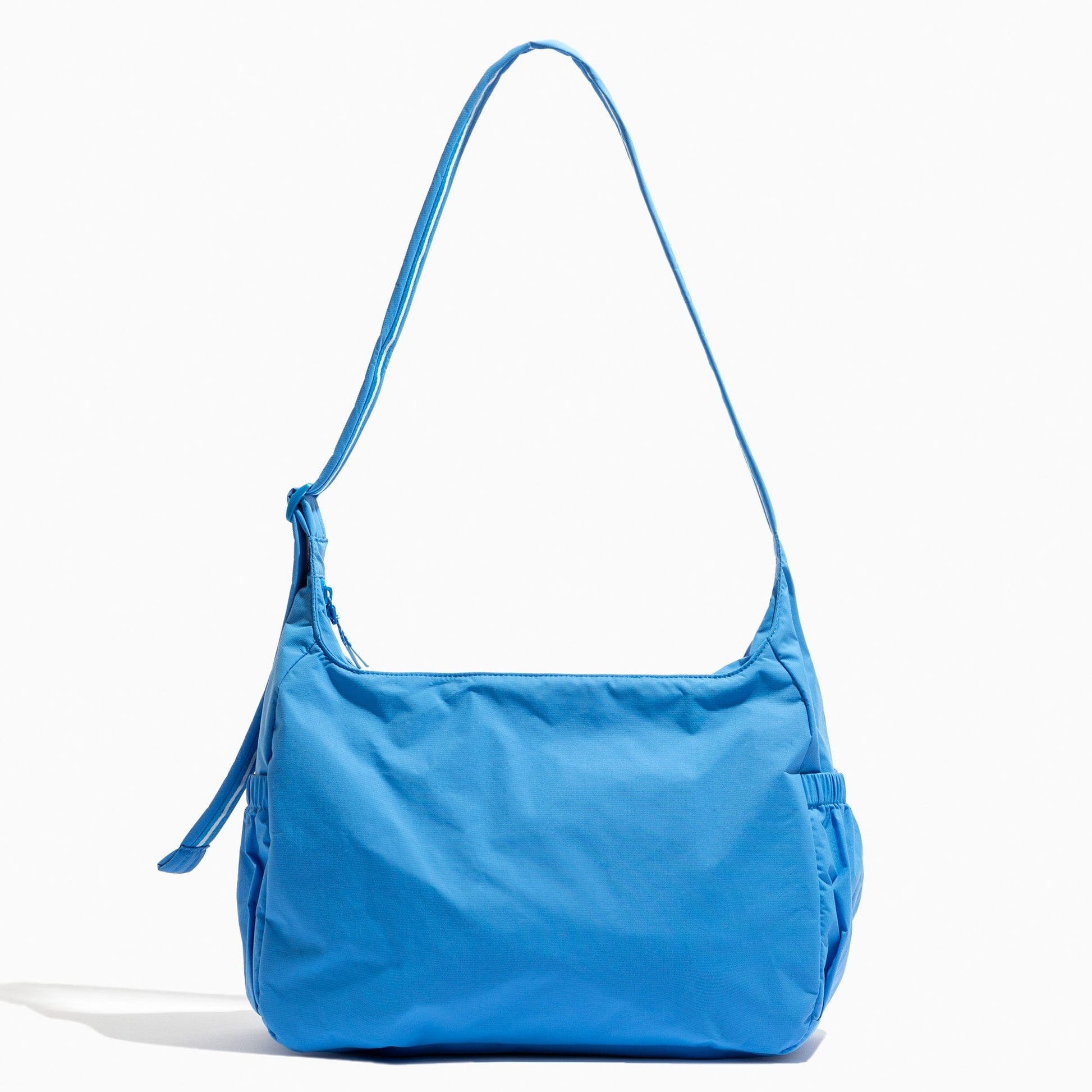 Close-up of the blue Wave Motion Carryall Tote with shoulder strap.