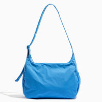 Close-up of the blue Wave Motion Carryall Tote with shoulder strap.