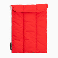 Front view of the Cherry Motion Laptop Sleeve in red with a quilted pattern.