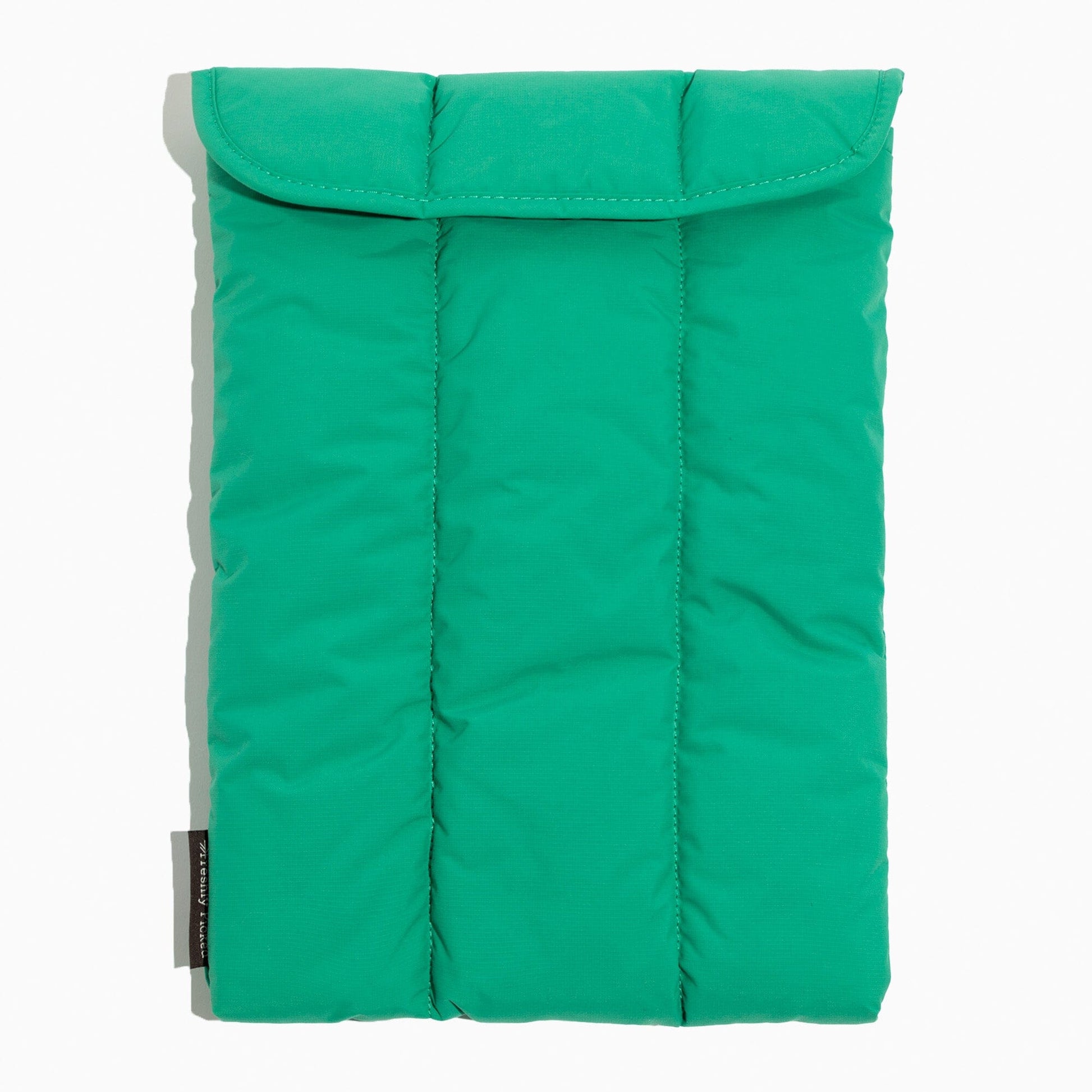 Top view of the Kelly Motion Laptop Sleeve in green with quilted design.