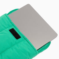 Kelly Motion Laptop Sleeve in green, showing a laptop inside with velcro closure.