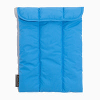 Close-up of the blue Wave Motion Laptop Sleeve with a velcro flap closure.