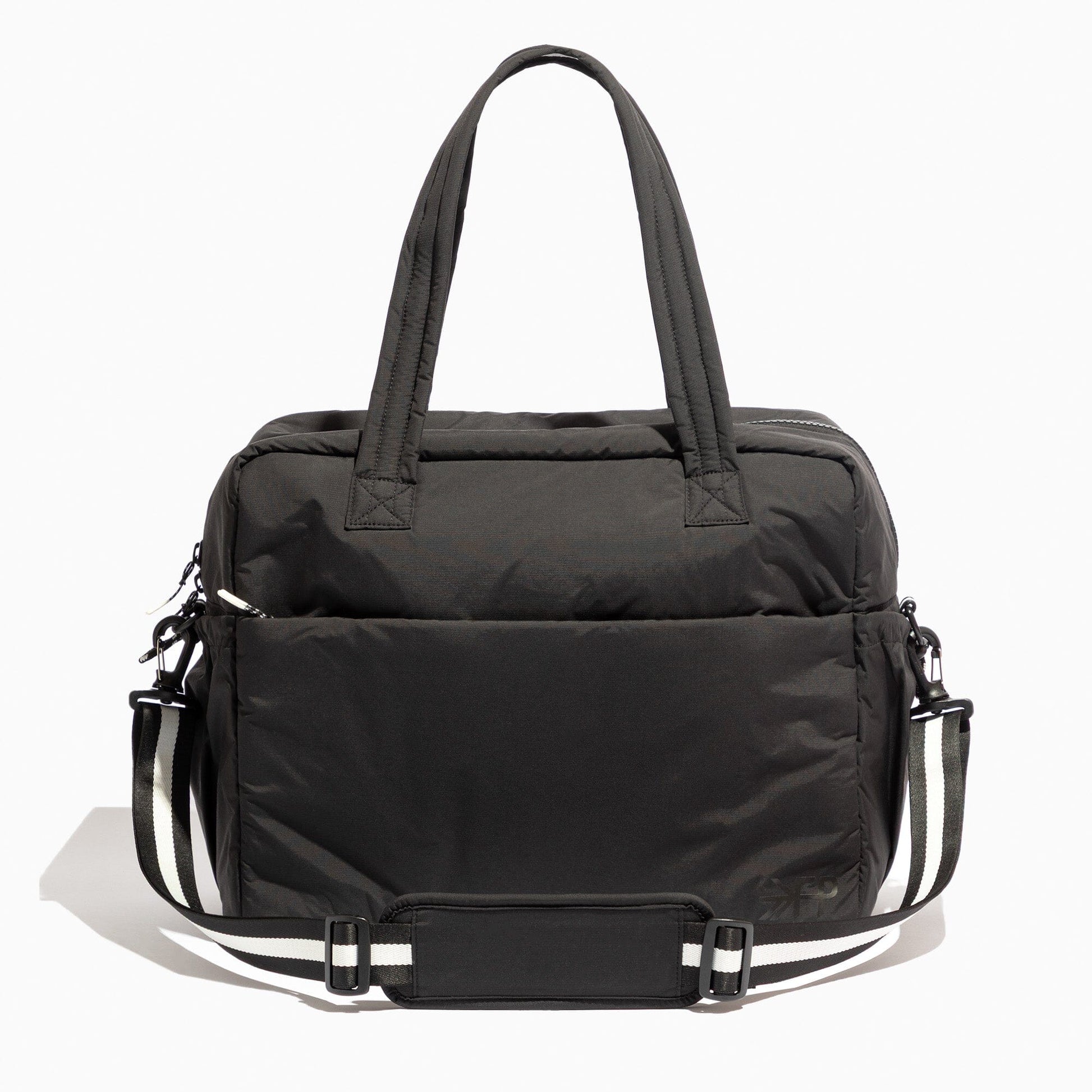 Jet Motion Overnight Duffle in black with top handles and shoulder strap, 'NEW!' badge.