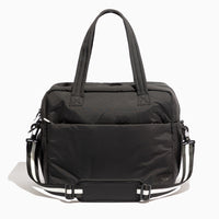 Jet Motion Overnight Duffle in black with top handles and shoulder strap, 'NEW!' badge.