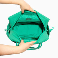 Open Kelly Motion Overnight Duffle in green, showing interior
