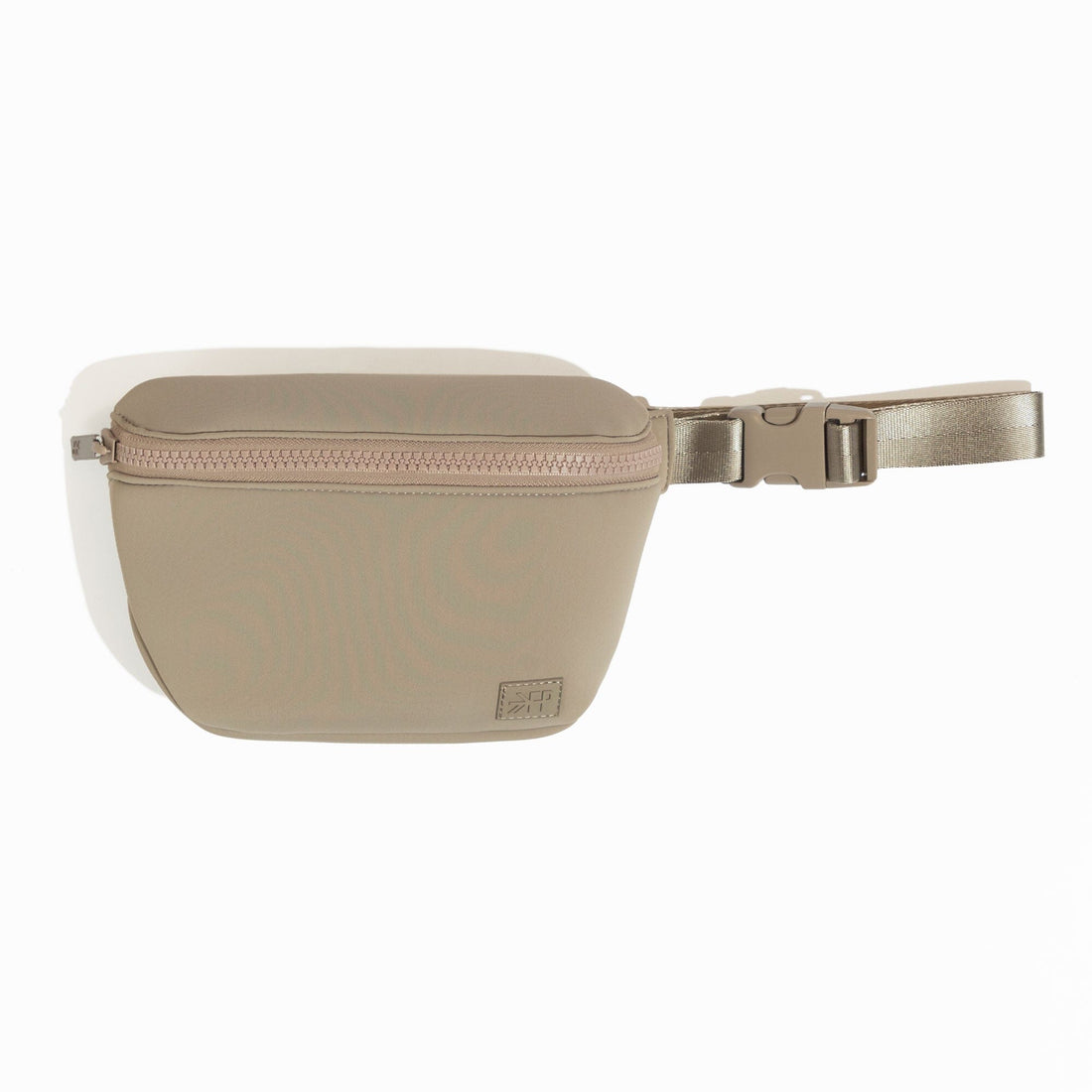 Aspen Seoul Neoprene Play Pack in sand, showing the adjustable belt and zipper closure.