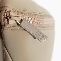 Close-up of the Aspen Seoul Neoprene Play Pack zipper and logo detail.