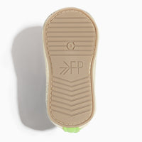 Close up of the lime green leather baby shoe toe.