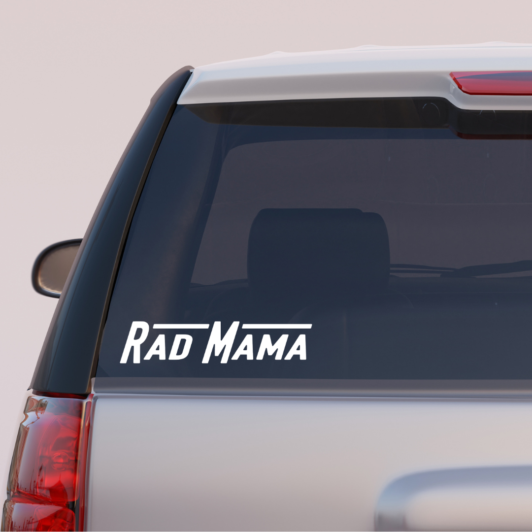 Rad Mama bumper sticker on a silver SUV's rear window.