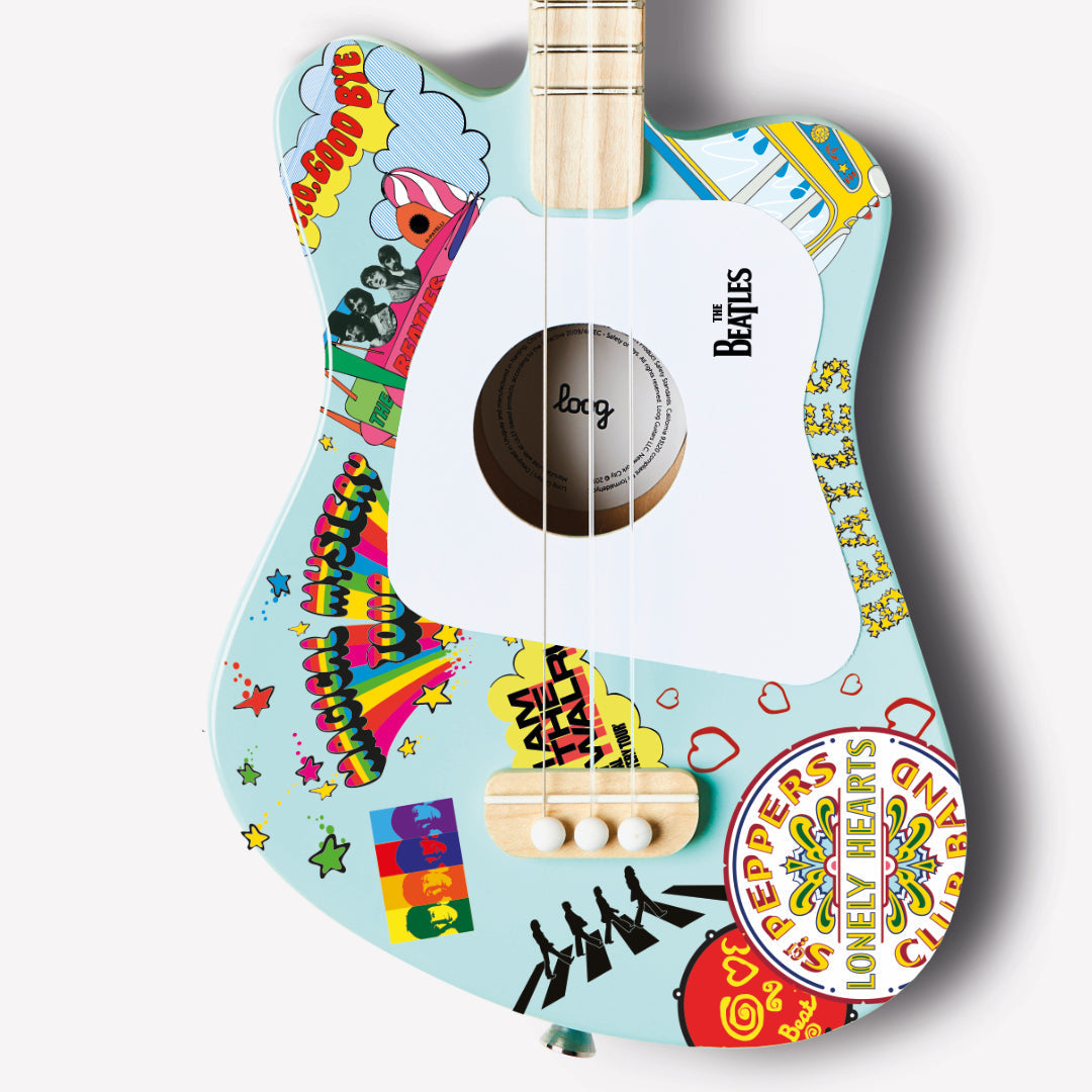 Close-up of the Beatles Loog Mini Guitar showing the colorful design