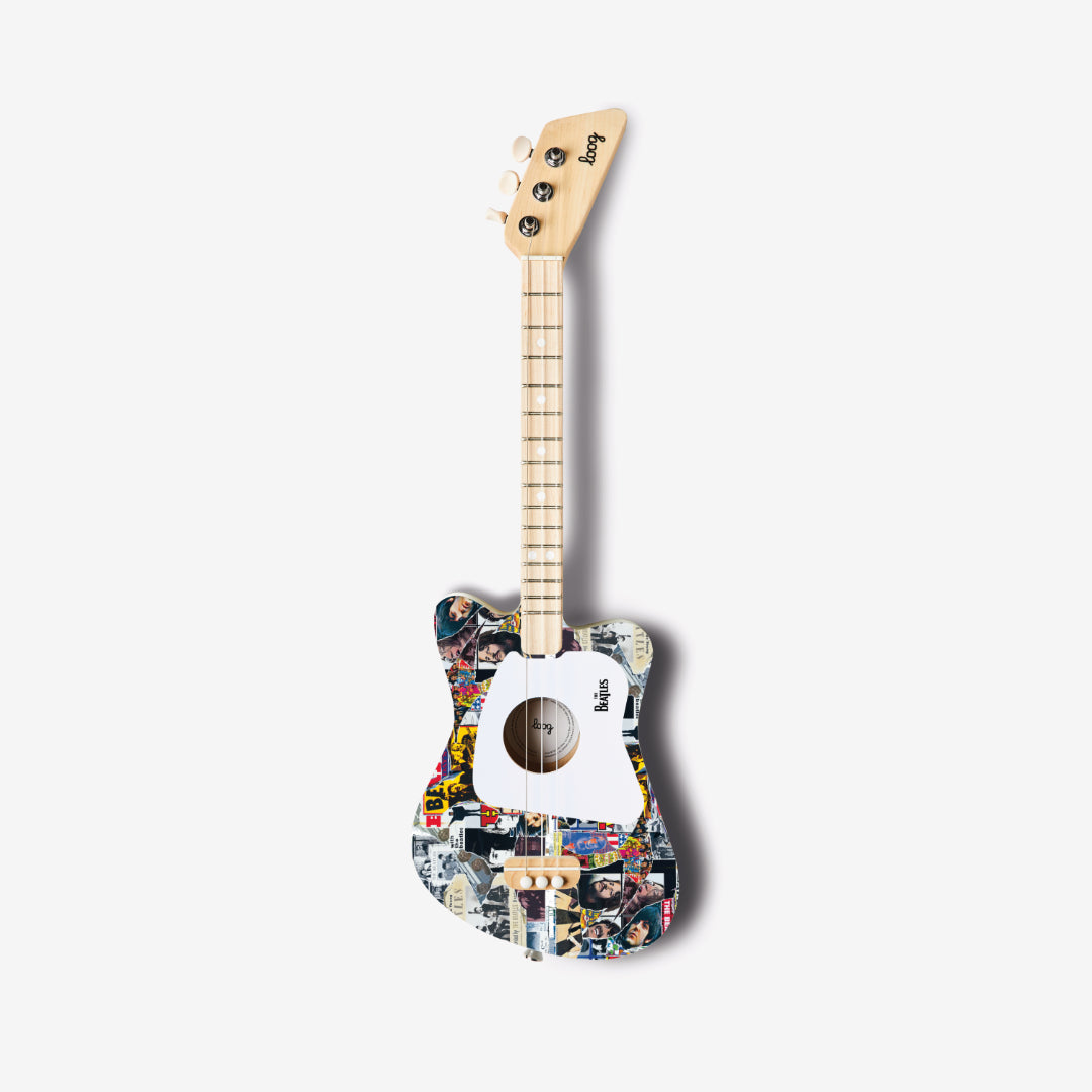 Full view of The Beatles Loog Mini Guitar with collage design on a white background.