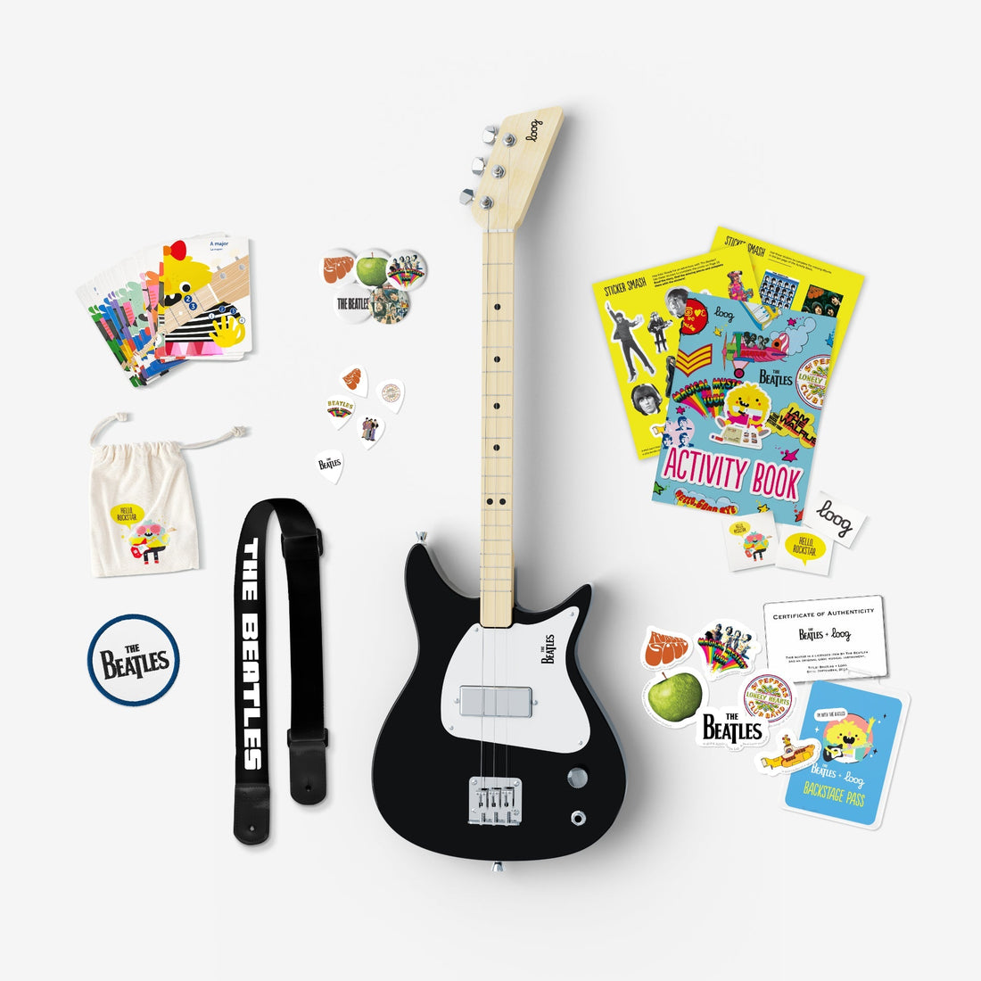 Black Beatles Loog 3-string electric guitar with strap, picks, activity book, and stickers.