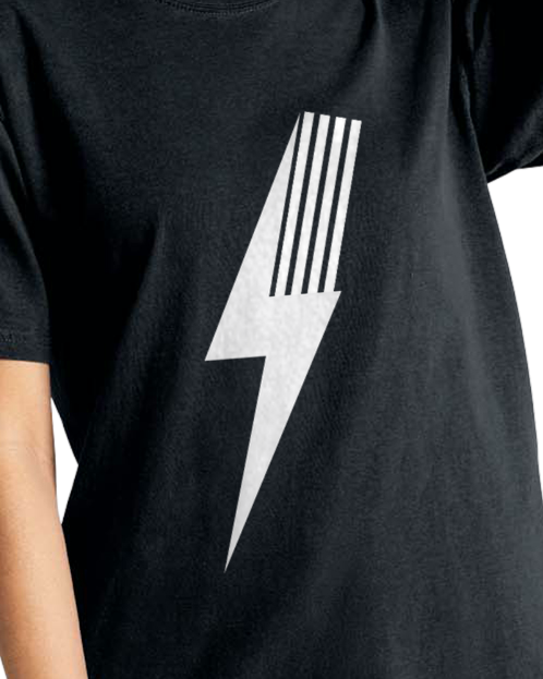 Close-up of white lightning bolt on black Adult Spark Tee.