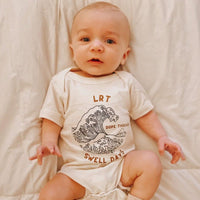 Dope Threads Swell Days cream onesie, modern and trendy apparel.