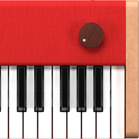 Close-up of a red Loog piano with wooden volume knob.