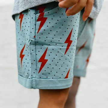 Spark Retro Shorts: Light blue with red lightning bolts and black polka dots.